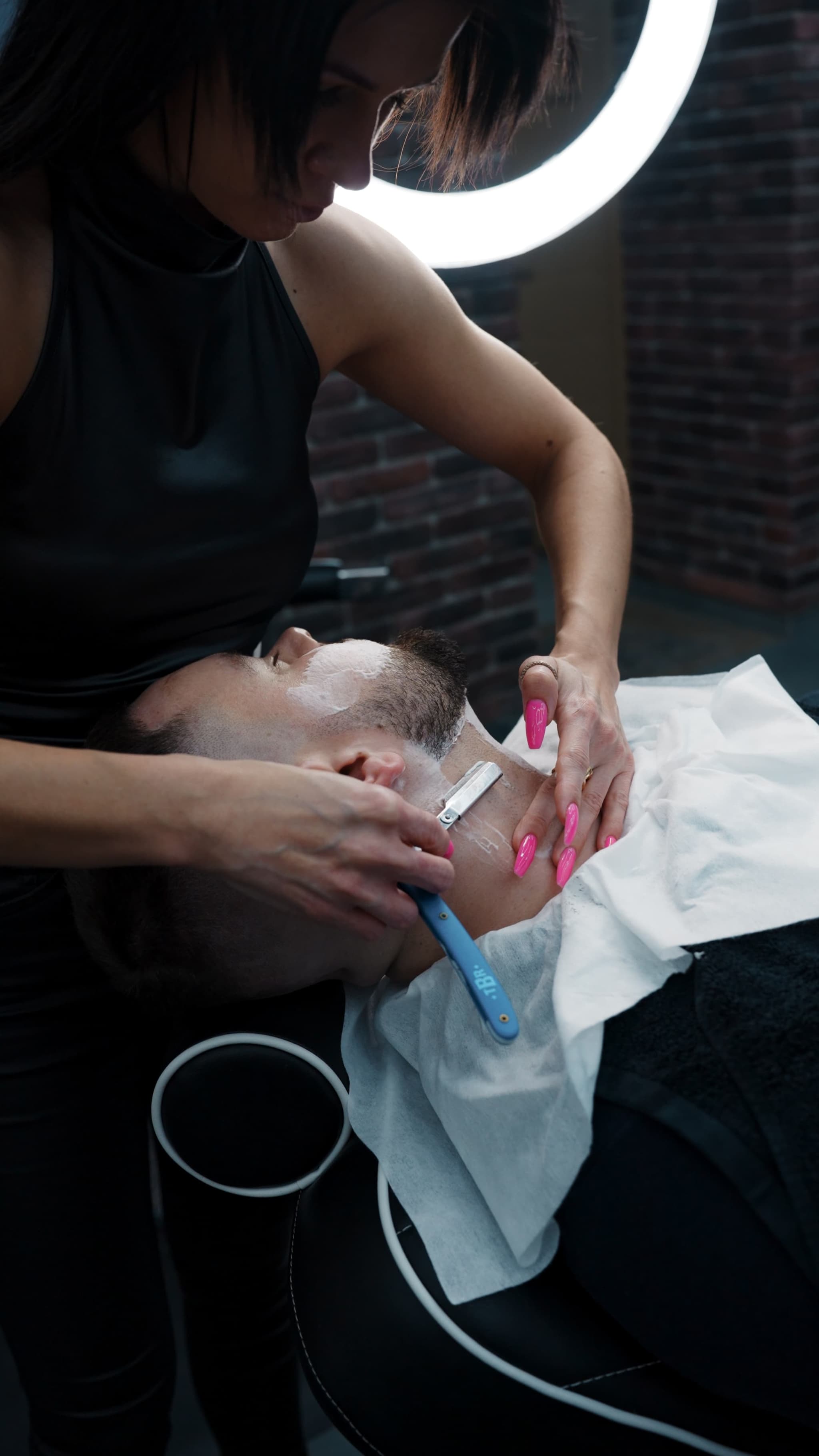 Traditional straight razor beard trim at PEAK Barbershop Riga.
